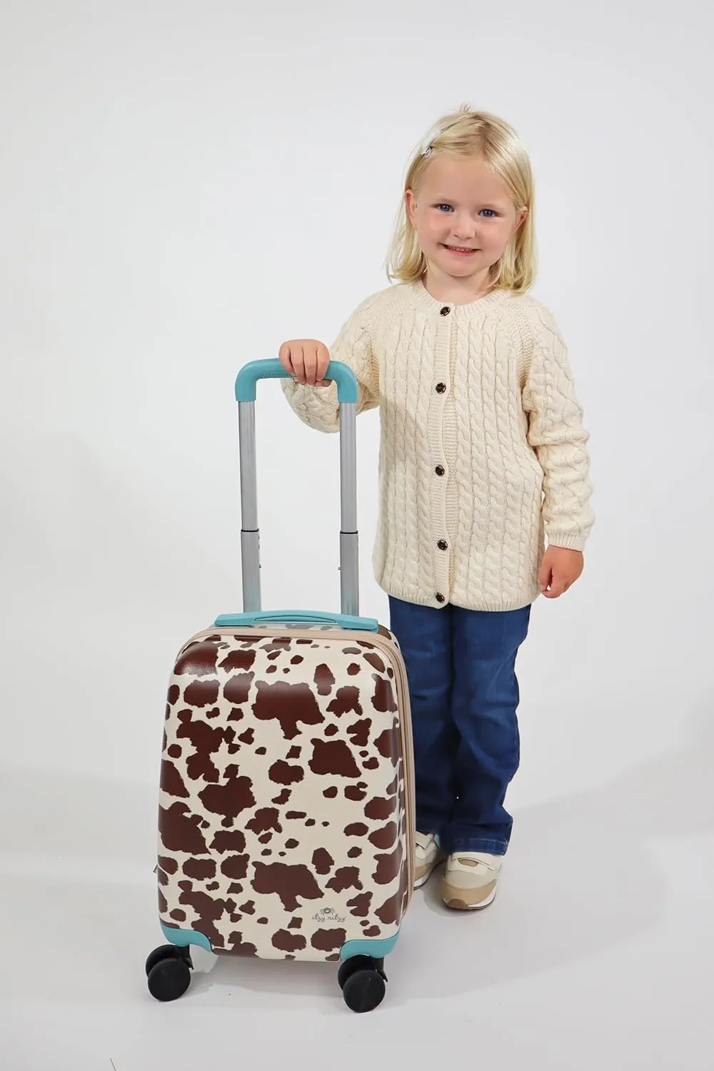 Itzy Ritzy Toddler Suitcase with Adjustable Handle, 360-Degree Spinner Wheels, 2 Interior Compartments and Hard Shell Design; Perfect Kids Luggage with Wheels for Ages 3 and Up (Cow Print)